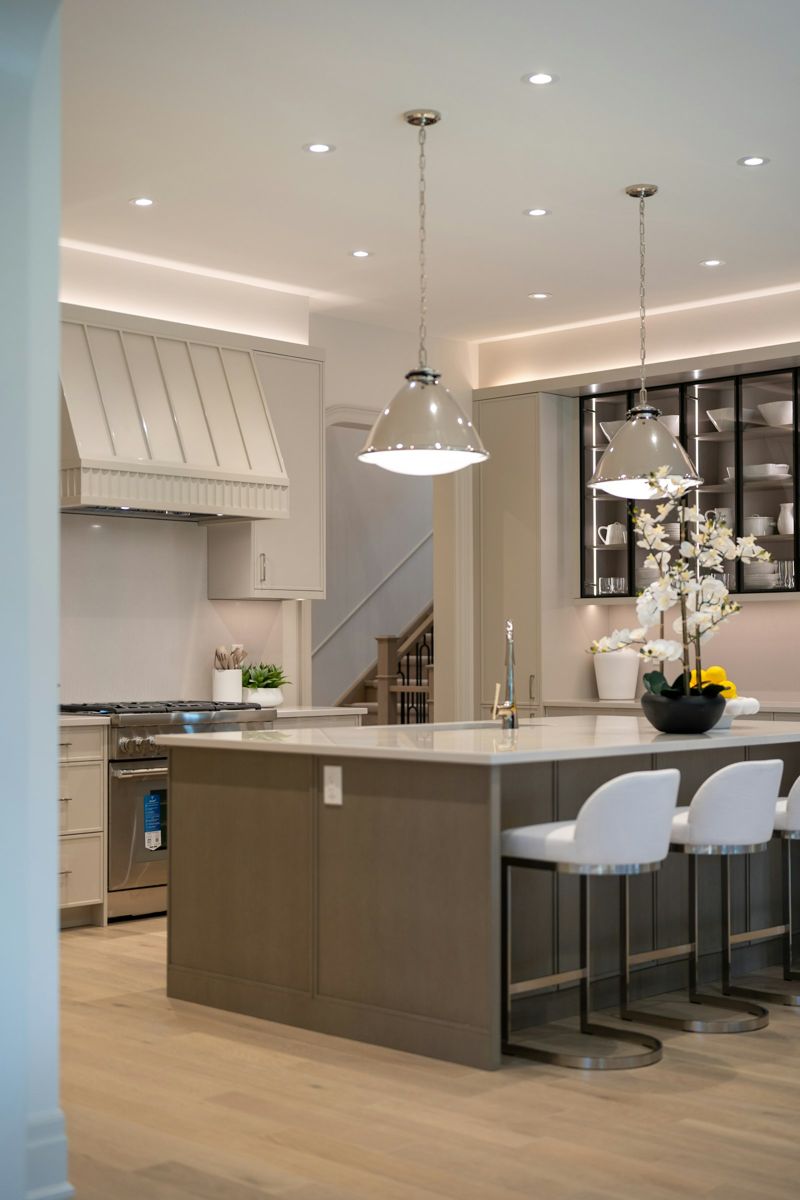 Classic white kitchen with plaster hood and large island